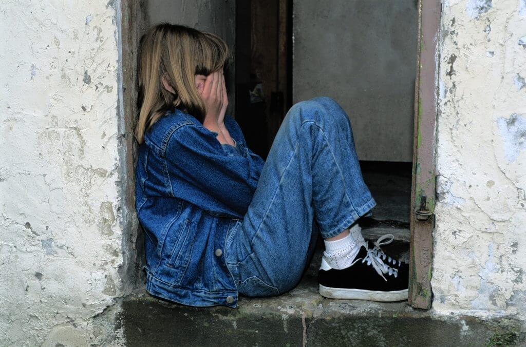 Turn Around Your Bad Day With Children - An upset child hides her face in her hands.